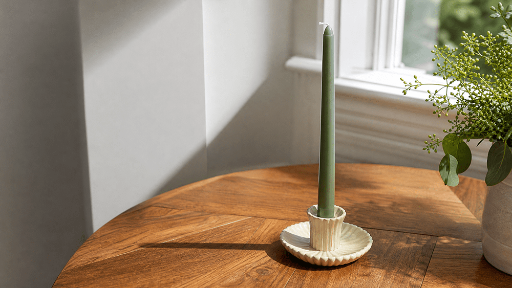 4 Costly Mistakes When Sourcing Wholesale Candles for Boutiques (And How to Avoid Them) Melt-resistant plant wax taper candle in sunlight, a safe choice for sourcing wholesale candles